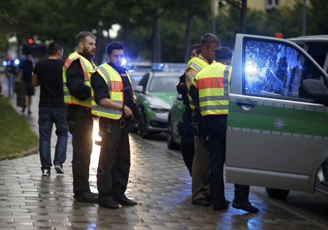 Police secure a street near to the scene of a shooting in Munich.  REUTERS/Michael Dalder