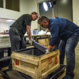 Paul Gardullo, left, museum curator, and maritime archeologist Jaco Boshoff, right, unpack iron ballast bars recovered from a shipwrecked slave ship and destined for the African American museum. MUST CREDIT: Washington Post photo by Bill O'Leary.
