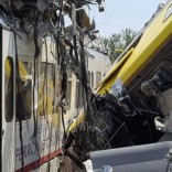 Two passenger trains are seen after a collision in the middle of an olive grove in the southern village of Corato, near Bari, Italy, in this handout picture released by Italian Firefighters July 12, 2016. Italian Firefighters/Handout via Reuters