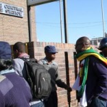 Zimbabwean Pastor Evan Mawarire (2nd R), who organized a 'stay at home' anti-government protest last week, arrives at the Harare Central Police station in Zimbabwe, July 12, 2016. REUTERS/Philimon Bulawayo
