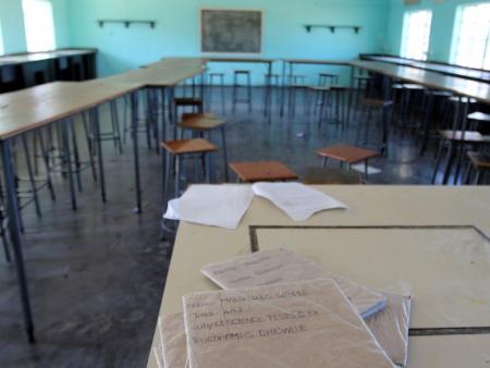 Books are seen in an empty classroom at Epworth Secondary School in Epworth near Harare, Zimbabwe, July 5, 2016. REUTERS/Philimon Bulawayo