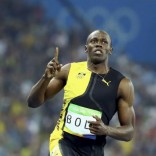Usain Bolt celebrates winning the gold medal. REUTERS/Lucy Nicholson