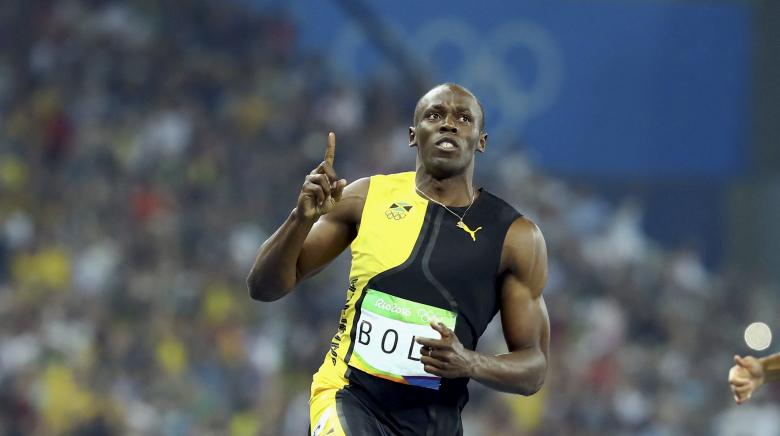 Usain Bolt celebrates winning the gold medal. REUTERS/Lucy Nicholson