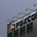 The logo of Foxconn, the trading name of Hon Hai Precision Industry, is seen on top of the company's headquarters in New Taipei City, Taiwan March 29, 2016. REUTERS/Tyrone Siu/File Photo