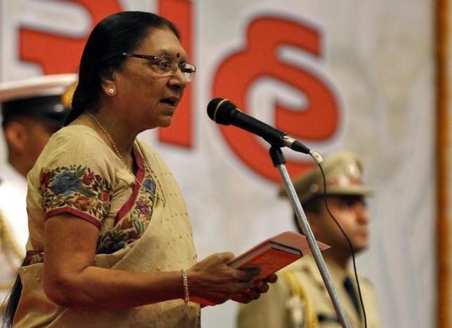 Anandiben Patel, the newly appointed chief minister of the western Indian state of Gujarat, takes her oath during a swearing-in ceremony at Gandhinagar in Gujarat May 22, 2014. REUTERS/Amit Dave