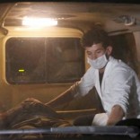 A wounded man lies inside an ambulance following an attack at American University of Afghanistan in Kabul, Afghanistan August 24, 2016. REUTERS/Mohammad Ismail