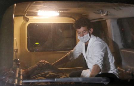 A wounded man lies inside an ambulance following an attack at American University of Afghanistan in Kabul, Afghanistan August 24, 2016. REUTERS/Mohammad Ismail