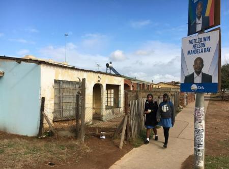 Schoolgirls walk past election posters for the opposition Democratic Alliance (DA) in Port Elizabeth, South Africa, ahead of local government elections, July 29, 2016. Picture taken July 29, 2016. REUTERS/Staff/Joe Brock