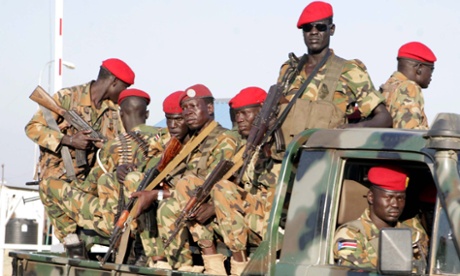 epa03997294 South Sudanese soldiers on their vehicle patrol a street in Juba, South Sudan, 20 December 2013. Three Indian soldiers in the United Nations peacekeeping mission to South Sudan were killed in an attack on 19 December, the first UN casualties since the ethnic-based violence began on 15 December in the capital, Juba. Hundreds of people died during the violence this week, while several hundred others fled the area.  EPA/PHILLIP DHIL