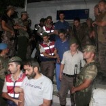 Turkish gendarmeries escort fugitive commandos who were involved in a bid to seize President Tayyip Erdogan during a failed coup attempt last month, as they leave from a gendarmerie station in Mugla province, Turkey, early August 1, 2016. REUTERS/Kenan Gurbuz