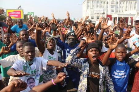 Supporters of Edgar Lungu, leader of the Patriotic Front party (PF), celebrate after Lungu narrowly won re-election on Monday, in a vote his main rival Hakainde Hichilema rejected on claims of alleged rigging by the electoral commission, in the capital, Lusaka, Zambia, August 15, 2016. REUTERS/Jean Serge Mandela