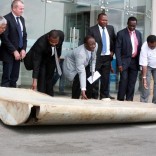 Tanzania Permanent Secretary to the ministry of Works, Transport and Communication Leonard Chamuriho (C) hands over of a wing suspected to be a part of missing Malaysia Airlines jet MH370 discovered on the island of Pemba, off the coast of Tanzania, in Dar es Salaam, Tanzania July 15, 2016. With him are Australia High Commissioner to East African John Feakes (2ndL) and Ministry of Transport Malaysian Senior Accident investigator Aslam Basha Kham (L).  REUTERS/Stringer