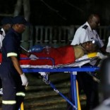 A miner is transported on a stretcher by rescue workers after he was rescued from below ground in Johannesburg's oldest gold mine in Langlaagte, South Africa, September 12, 2016. REUTERS/Siphiwe Sibeko