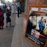 An advertising poster for an Indian film is seen outside a movie theater in Karachi, Pakistan, September 30, 2016. REUTERS/Akhtar Soomro