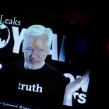 Julian Assange, Founder and Editor-in-Chief of WikiLeaks speaks via video link during a press conference on the occasion of the ten year anniversary celebration of WikiLeaks in Berlin, Germany, October 4, 2016.    REUTERS/Axel Schmidt