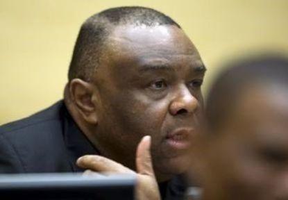 Former Congo vice-president Jean-Pierre Bemba looks up when sitting in the courtroom of the International Criminal Court to stand trial with Aime Kilolo Musamba, Jean-Jacques Mangenda Kabongo, Fidele Babala Wandu and Narcisse Arido, on charges including corrupting witnesses and interfering with the administration of justice in The Hague, Netherlands, September 29, 2015.  REUTERS/Peter Dejong/Pool