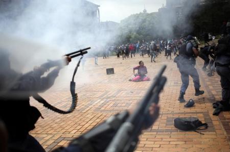 A student is seen during clashes with South African police at Johannesburg's University of the Witwatersrand, South Africa, October 4, 2016. REUTERS/Siphiwe Sibeko