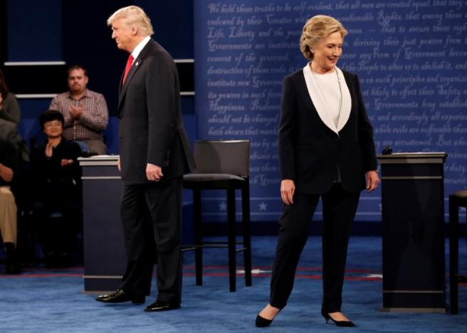 Republican U.S. presidential nominee Donald Trump and Democratic U.S. presidential nominee Hillary Clinton appear together during their presidential town hall debate at Washington University in St. Louis, Missouri, U.S., October 9, 2016.   REUTERS/Mike Segar
