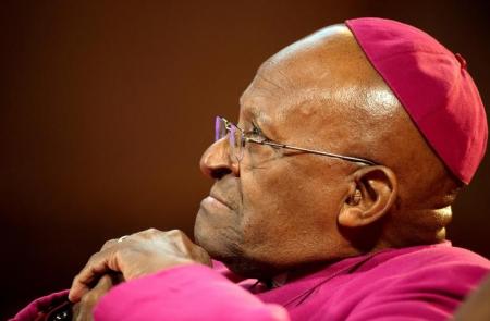 The former Anglican archbishop of Cape Town Desmond Tutu waits to receive the 2013 Templeton Prize at the Guildhall in central London on May 21, 2013.  REUTERS/Paul Hackett/File Photo