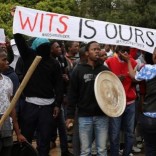 Students chant slogans during clashes with the South African police at Johannesburg's University of the Witwatersrand, South Africa, October 4, 2016. REUTERS/Siphiwe Sibeko