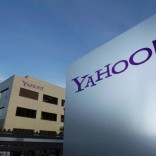 A Yahoo logo is pictured in front of a building in Rolle, 30 km (19 miles) east of Geneva, December 12, 2012.   REUTERS/Denis Balibouse/File photo