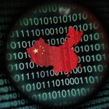 A map of China is seen through a magnifying glass on a computer screen showing binary digits in Singapore in this January 2, 2014 photo illustration. REUTERS/Edgar Su