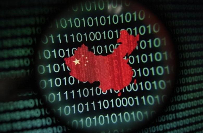 A map of China is seen through a magnifying glass on a computer screen showing binary digits in Singapore in this January 2, 2014 photo illustration. REUTERS/Edgar Su