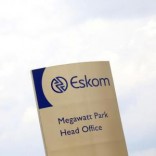 An Eskom logo is seen at the entrance of their head offices in Sunninghill, Sandton, February 24, 2016. South Africa's energy regulator Nersa said on Wednesday it had postponed a decision on tariffs charged by state-run power utility Eskom to March 1 from Feb 25 as it seeks further clarity on diesel costs. REUTERS/Siphiwe Sibeko