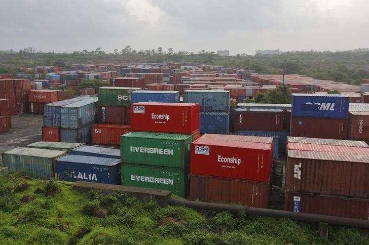 Cargo containers are seen stacked outside the container terminal of Jawaharlal Nehru Port Trust (JNPT) in Mumbai, July 15, 2015. REUTERS/Shailesh Andrade/Files