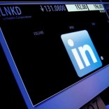 The ticker symbol and trading information for LinkedIn Corp. is displayed on a screen  at the post where it is traded, before the start of trading, on the floor of the New York Stock Exchange (NYSE) in New York City, U.S., June 13, 2016.  REUTERS/Brendan McDermid/File Photo