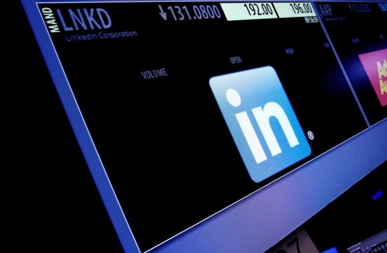 The ticker symbol and trading information for LinkedIn Corp. is displayed on a screen  at the post where it is traded, before the start of trading, on the floor of the New York Stock Exchange (NYSE) in New York City, U.S., June 13, 2016.  REUTERS/Brendan McDermid/File Photo