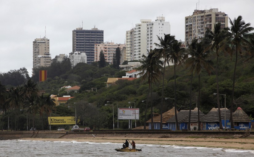 Fishermen cast their nets beneath the skyline of Mozambique's capital Maputo in this file picture taken November 2009. At Bobole, a bustling refreshment stop on Mozambique's north-south highway, brightly-painted kiosks lined with bottles offer drinks to thirsty travellers while hawkers sell bananas, paw-paws and carrots in a typical African roadside scene. But memories remain fresh of when Bobole lay in the "death corridor" of a civil war that cost nearly one million Mozambicans their lives until it ended two decades ago. In 2013 a series of hit-and-run raids by opposition Renamo gunmen about 600 km (375 miles) further north has rekindled fears of a return to all-out conflict in what has become one of Africa's economic growth stars. To match Insight MOZAMBIQUE-POLITICS/  REUTERS/Mike Hutchings/Files (MOZAMBIQUE - Tags: BUSINESS POLITICS CIVIL UNREST SOCIETY) - RTX11W3A