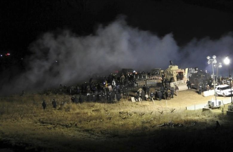 Law enforcement officers surround demonstrators protesting against plans to pass the Dakota Access pipeline during a standoff at the Backwater Bridge in Morton County, North Dakota, U.S., November 20, 2016.  Courtesy of Morton County Sheriff's Department/Handout via REUTERS