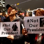 Protesters shout slogans after they are blocked by riot policemen in a road nearby the presidential Blue House during their march calling South Korean President Park Geun-hye to step down in Seoul, South Korea, November 19, 2016. REUTERS/Kim Kyung-Hoon