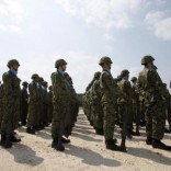 Soldiers of Japan's Self Defence Force stand at attention during the opening ceremony of a military base on the island of Yonaguni in the Okinawa prefecture, March 28, 2016.     REUTERS/Nobuhiro Kubo