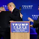 U.S. Republican presidential nominee Donald Trump is hustled off the stage by security agents after a perceived threat in the crowd, at a campaign rally in Reno, Nevada, U.S. November 5, 2016. REUTERS/Steven Styles