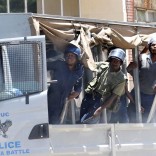 Riot police look on during a demonstration against the new ‘bond notes’ that came into circulation this week in an attempt to ease chronic cash shortages, in the capital Harare, Zimbabwe, November 30, 2016. REUTERS/Philimon Bulawayo