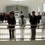 U.S. President Barack Obama (2ndR) releases flower petals following a wreath-laying ceremony with Japanese Prime Minister Shinzo Abe (L) aboard the USS Arizona Memorial at Pearl Harbor, Hawaii, U.S., December 27, 2016. REUTERS/Kevin Lamarque