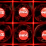 Logos are seen on Coca-Cola bottles in Zurich, February 16, 2011. REUTERS/Christian Hartmann/File Photo