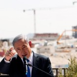 Israeli Prime Minister Benjamin Netanyahu delivers a statement in front of a new construction, in the Jewish settlement known to Israelis as Har Homa and to Palestinians as Jabal Abu Ghneim, in an area of the West Bank that Israel captured in a 1967 war and annexed to the city of Jerusalem, March 16, 2015. REUTERS/Ronen Zvulun/File Photo