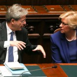 Newly appointed Italian Prime Minister Paolo Gentiloni (L) talks with Defence Minister Roberta Pinotti before a confidence vote at the parliament in Rome, Italy, December 13, 2016. REUTERS/Alessandro Bianchi
