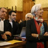 Managing Director of the International Monetary Fund (IMF) Christine Lagarde stands near her lawyer Patrick Maisonneuve (L) before the start of her trial about a state payout in 2008 to a French businessman, at the courts in Paris, France, December 12, 2016.   REUTERS/Charles Platiau