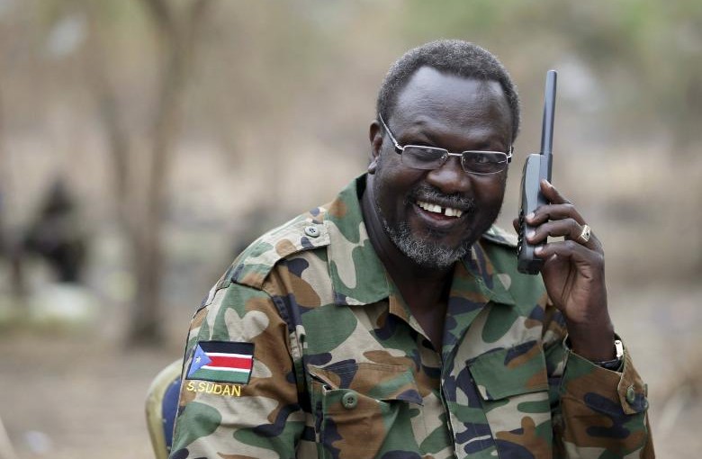 File photo: South Sudan's rebel leader Riek Machar talks on the phone in his field office in a rebel-controlled territory in Jonglei State, South Sudan, February 1, 2014. REUTERS/Goran Tomasevic/File Photo