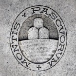 A logo of Monte dei Paschi di Siena bank is seen on the ground in Siena, Italy, November 5, 2014. REUTERS/Giampiero Sposito/File Photo
