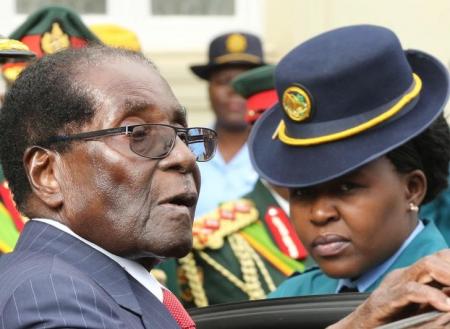 President Robert Mugabe leaves after delivering his State Of the Nation address at Parliament in Harare, Zimbabwe, December 6, 2016.   REUTERS/Philimon Bulawayo
