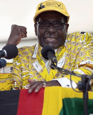 Zimbabwe President and Zanu-PF ruling party leader Robert Mugabe delivers his key note address during the official opening of the 6th Peoples Congress of Zanu-PF in Harare on December 4, 2014. Mugabe sought to shut down a bubbling succession battle at a key party congress, warning that his embattled deputy and onetime heir apparent could face criminal charges.
AFP PHOTO/JEKESAI NIJIKIZAMA