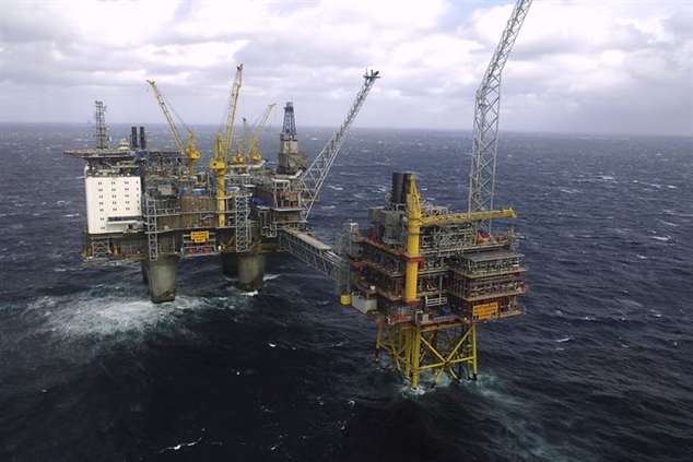FILE - This April 19, 2007 aerial file photo shows the Oseberg oil platform in the Norwegian sea. After a decade of an oil and gas boom, plunging energy prices are shaking the Norwegians out of a Utopian reverie that guaranteed workers lengthy summer vacations, generous health and social benefits and allowed them to leave work at 4 p.m. and even earlier on Fridays. (AP Photo/NTB Scanpix,  Helge Hansen, File) Norway Oil Pains