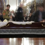 People walk past the coffin containing the body of Russian ambassador to Turkey Andrei Karlov, who was shot dead by an off-duty policeman while delivering a speech in an Ankara art gallery on December 19, during a memorial service at the Christ the Savior Cathedral in Moscow, Russia December 22, 2016. REUTERS/Maxim Shemetov