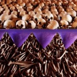 The skulls and bones of Rwandan victims rest on shelves at a genocide memorial inside the church at Ntarama just outside the capital Kigali, August 6, 2010. REUTERS/Finbarr O'Reilly/File Photo