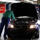 A worker inspects cars at BMW's manufacturing plant in Rosslyn, outside Pretoria,  file. REUTERS/Siphiwe Sibeko
